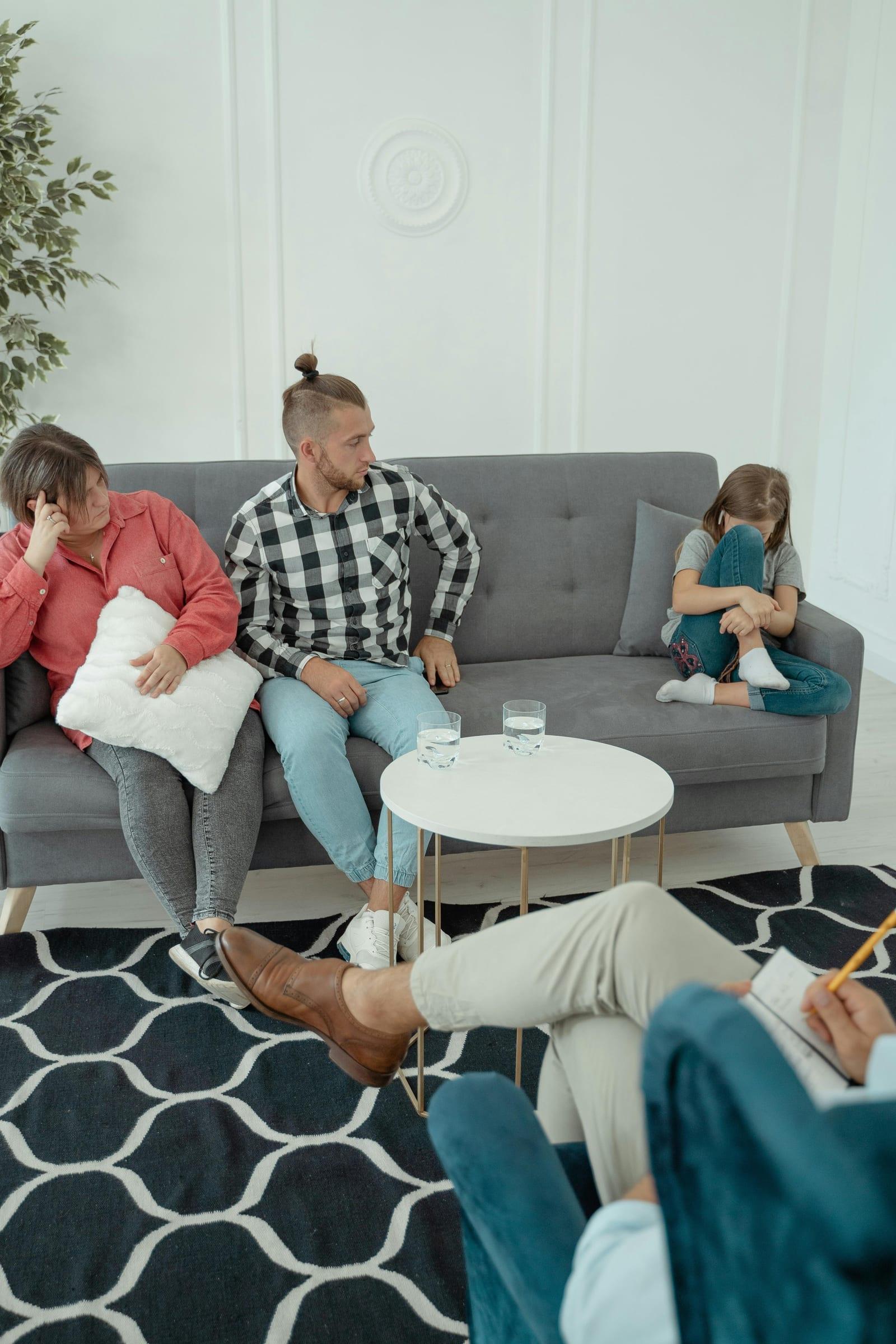 Parents and child in a family counselling session with a psychologist